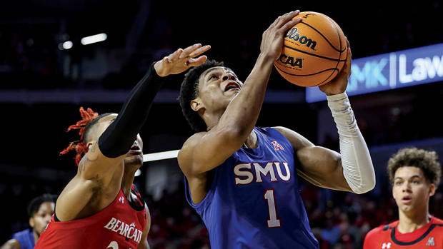 Southern Methodist Mustangs guard Zhuric Phelps drives to the basket against Cincinnati Bearcats guard Jeremiah Davenport (24) in the second half at Fifth Third Arena.